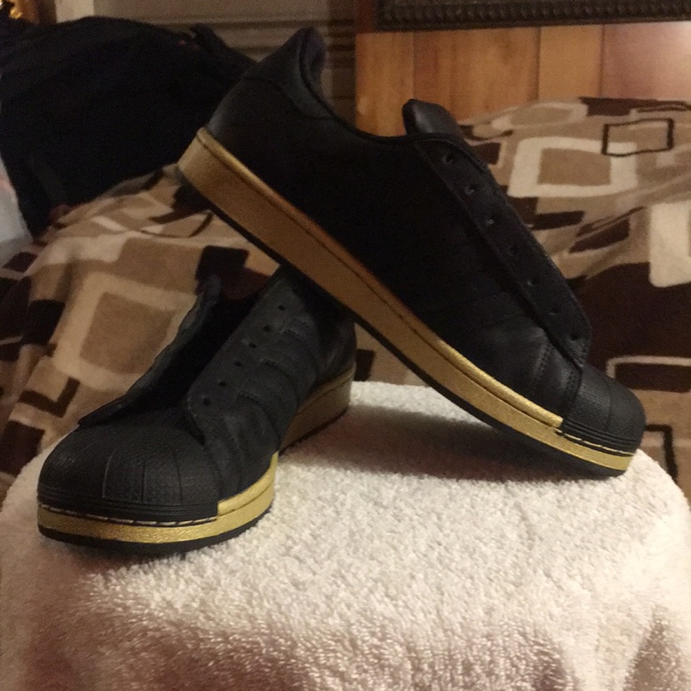 Adidas Black and Gold Superstar men’s size 9